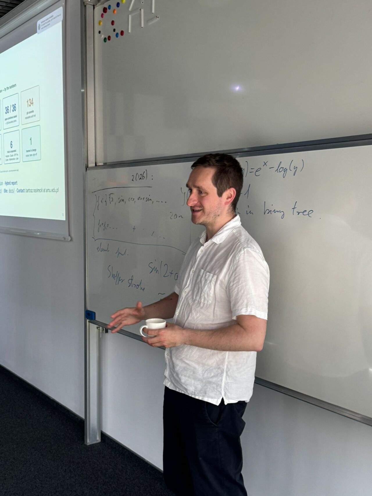 Przemek Chojecki at the whiteboard during the AI for Science session