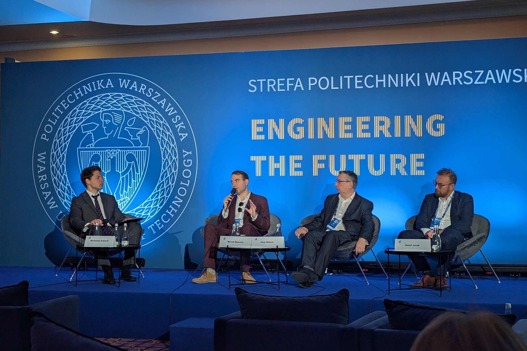 The panel on AI in biomedicine, moderated by Bartłomiej Sobieski