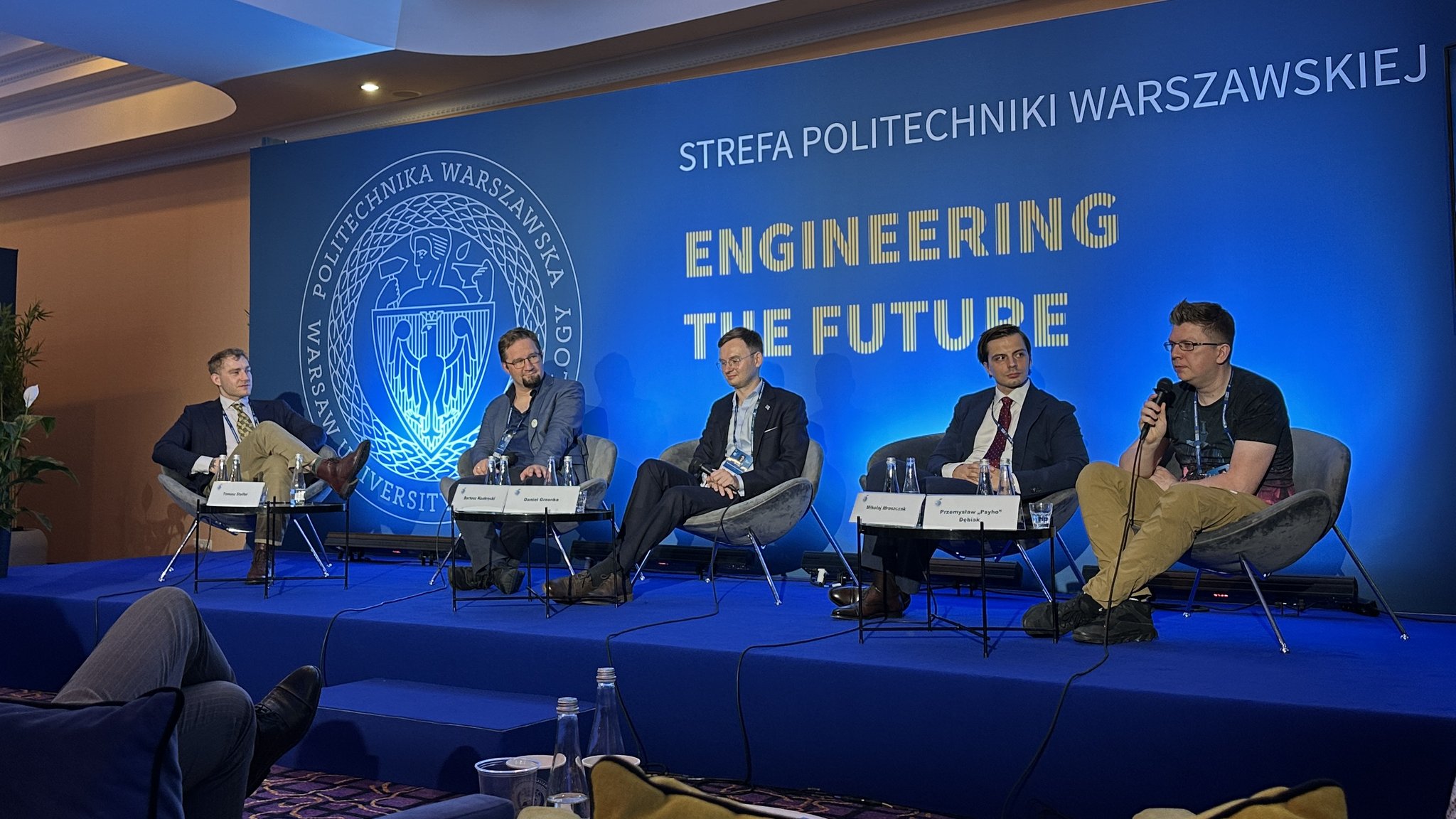 The panel on AI agents seen from the audience in the Warsaw University of Technology zone